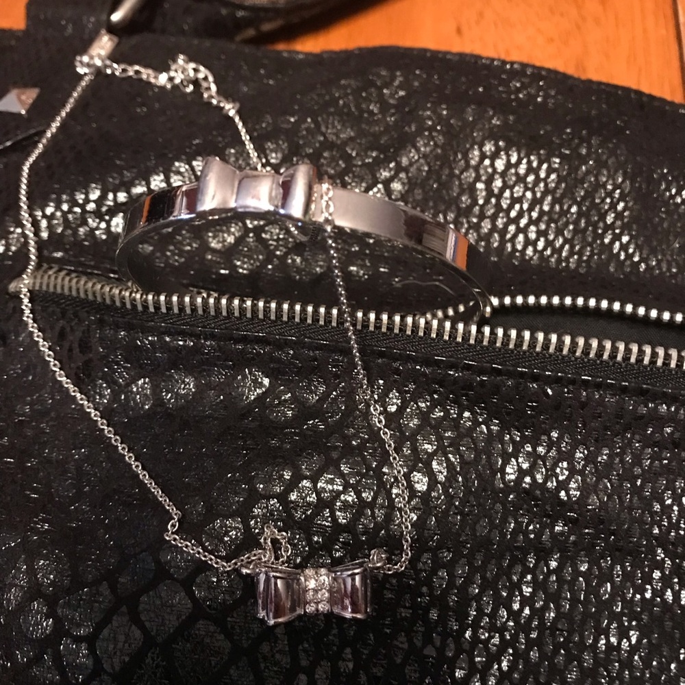 Kate Spade bow necklace with matching bracelet.